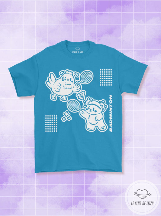 Blue t-shirt with white graphics on a purple and white patterned background
