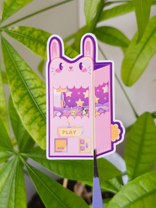 Kawaii bunny claw machine vinyl sticker, cute gaming design for laptop decoration